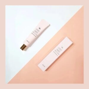 RiRe Lucent White Tone-Up Cream pale pink tube with rose gold cap and matching box on pink and white
