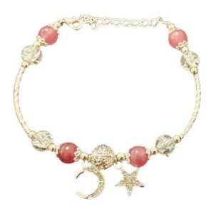 Gold-tone bracelet with pink and clear beads, crescent moon and star charms and an extension chain